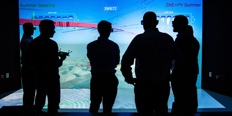 Joint Institute for Strategic Energy Analysis People standing in front of a large screen